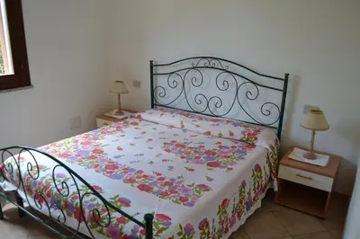 Letto o letti in una camera di Residence L'Uddastru