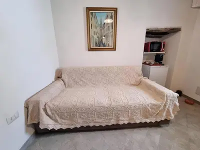 Letto o letti in una camera di La Casetta Sarda Centro Storico Spiagge vicine per ogni tipo di vacanza