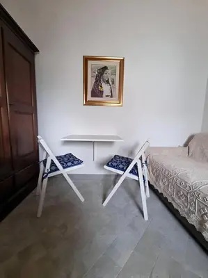 Letto o letti in una camera di La Casetta Sarda Centro Storico Spiagge vicine per ogni tipo di vacanza