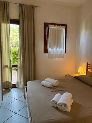 Letto o letti in una camera di Il Borgo Appartamenti by KasaVacanze