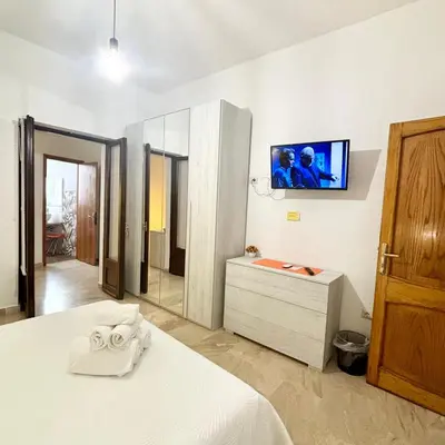 Letto o letti in una camera di CASA DEL CORSO