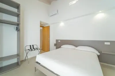 Letto o letti in una camera di Nuova -Luxury Rooms & Apartment-