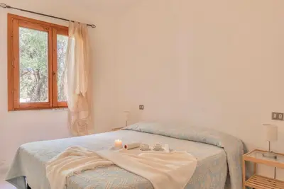 Letto o letti in una camera di ISA-apartments with air conditioning and private outdoor space in San Teodoro