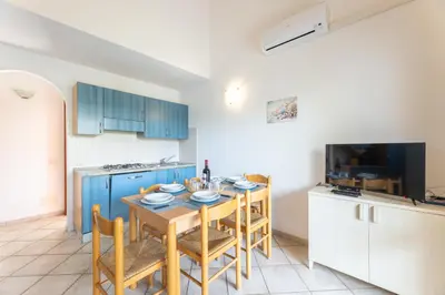Cucina o angolo cottura di ISA-Apartments with air conditioning and external outdoor space in Budoni, at only 300 m from the beach