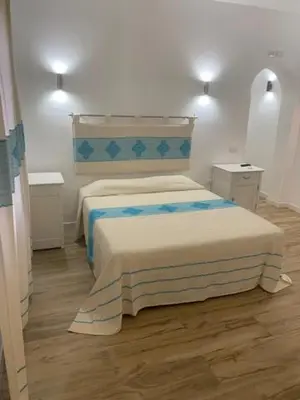 Letto o letti in una camera di B&B Olbia City Center