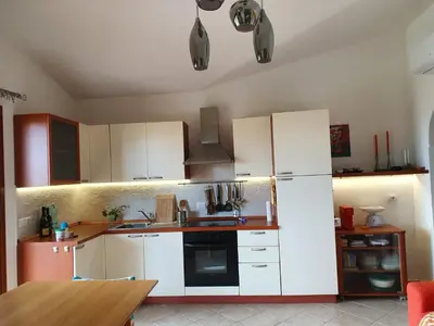 Cucina o angolo cottura di Villetta in Residence La Bouganville