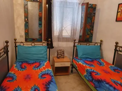 Letto o letti in una camera di Villetta in Residence La Bouganville