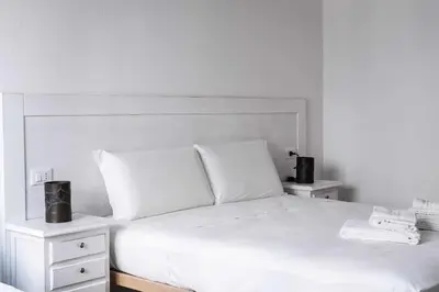 Letto o letti in una camera di Domo Orise Alloggio in pieno centro