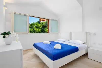 Letto o letti in una camera di Appartamento Glory - Golfo Aranci, Baia Caddinas