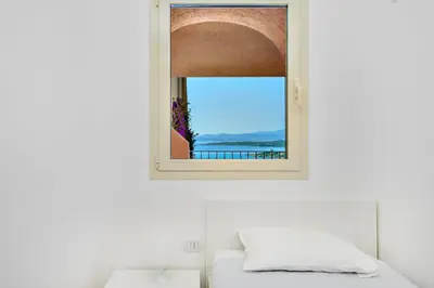 Letto o letti in una camera di Appartamento Glory - Golfo Aranci, Baia Caddinas
