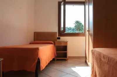 Letto o letti in una camera di ISA - Residence Cala Viola