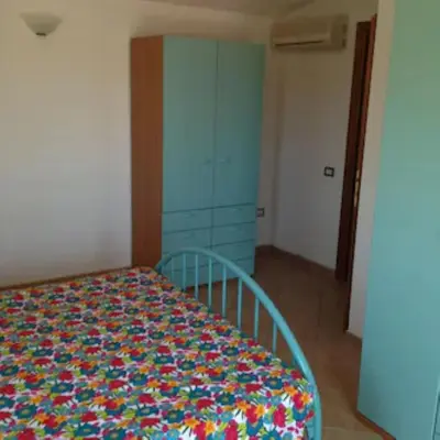 Letto o letti in una camera di Villetta con giardino e posto auto