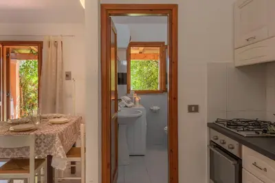 Cucina o angolo cottura di Outstanding Residenze Gallura 2 Bedroom sleeps with Child