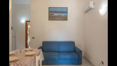 Area soggiorno di Outstanding Residenze Gallura 2 Bedroom sleeps with Child