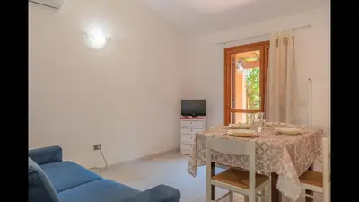 TV o dispositivi per l'intrattenimento presso Outstanding Residenze Gallura 2 Bedroom sleeps with Child