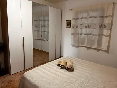 Letto o letti in una camera di Adele casa vacanza