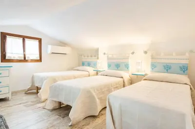 Letto o letti in una camera di Cala Paradiso Apartment 