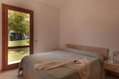 Letto o letti in una camera di Simple Gem of Le Dimore di Budoni