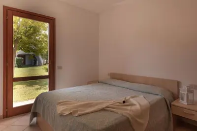 Letto o letti in una camera di Simple Gem of Le Dimore di Budoni