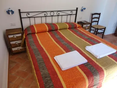 Letto o letti in una camera di Bed and Breakfast Ichnos