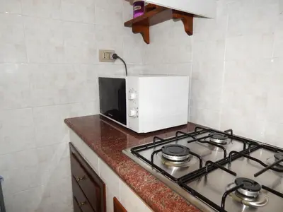Cucina o angolo cottura di Casa Lia appartamento indipendente con patio privato nel Golfo di Orosei