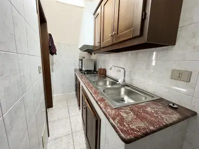 Cucina o angolo cottura di Casa Lia appartamento indipendente con patio privato nel Golfo di Orosei