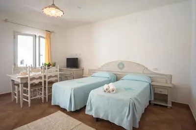 Letto o letti in una camera di Superb Le Residenze del Golfo di Orosei no2190