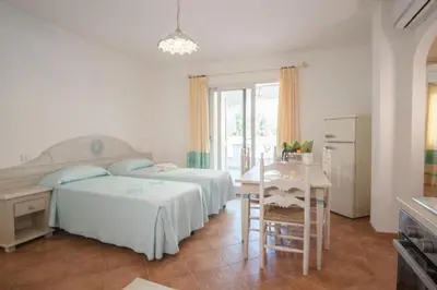 Letto o letti in una camera di Superb Le Residenze del Golfo di Orosei num2191