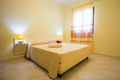 Letto o letti in una camera di Relaxing Le Residenze del Maria Rosaria no2210 sleeps 3 persons
