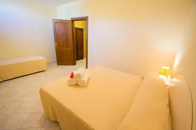 Letto o letti in una camera di Relaxing Le Residenze del Maria Rosaria no2210 sleeps 3 persons