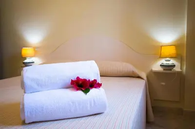 Letto o letti in una camera di Relaxing Le Residenze del Maria Rosaria no2213