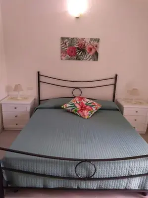 Letto o letti in una camera di Vista mare con piscina a Budoni - Baia Sant’Anna