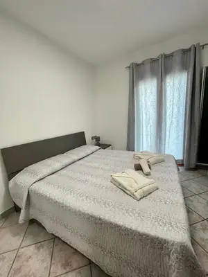 Letto o letti in una camera di Casa Fralia