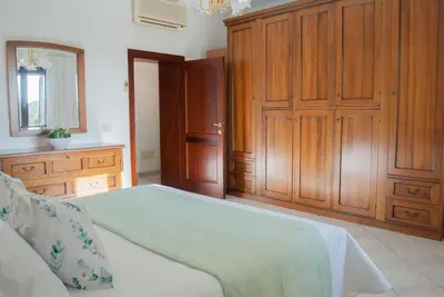 Letto o letti in una camera di Casa Maddalena