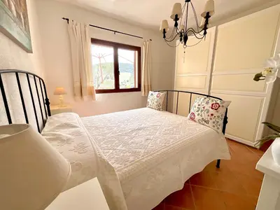 Letto o letti in una camera di VillaFe San Teodoro