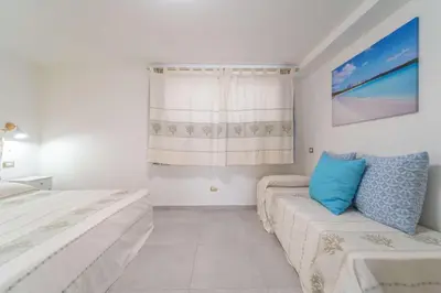 Letto o letti in una camera di La Stampa Home