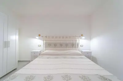 Letto o letti in una camera di La Stampa Home