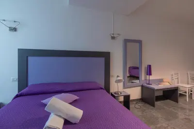 Letto o letti in una camera di Delta Rooms