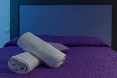 Letto o letti in una camera di Delta Rooms