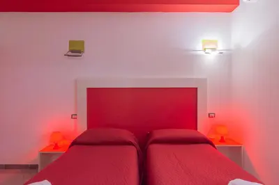 Letto o letti in una camera di Delta Rooms