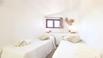 Letto o letti in una camera di Villa Sa Mama
