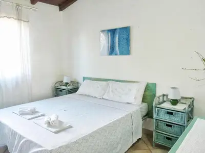 Letto o letti in una camera di Le Caterine