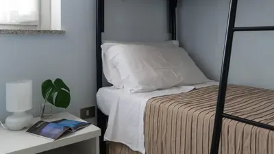Letto o letti in una camera di Green and Blue vista mare Cala Gonone