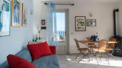 Area soggiorno di Green and Blue vista mare Cala Gonone