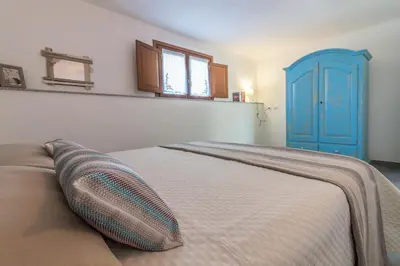 Letto o letti in una camera di Villa Cala di Luce - Teloni