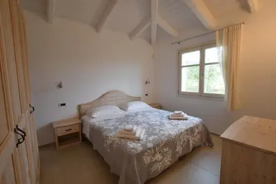 Letto o letti in una camera di Villa Helios