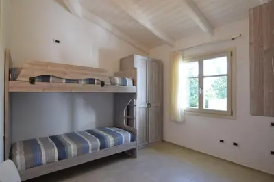 Letto o letti in una camera di Villa Helios