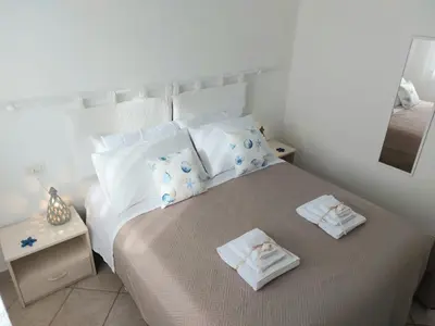 Letto o letti in una camera di Casa Minuredda