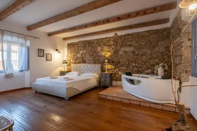 Letto o letti in una camera di Dimoras Stone Suites