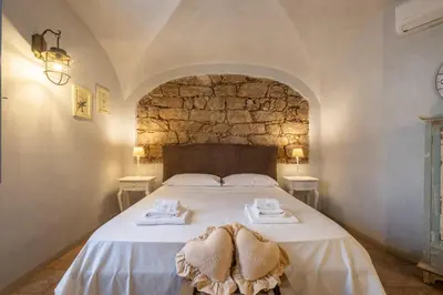 Letto o letti in una camera di Dimoras Stone Suites
